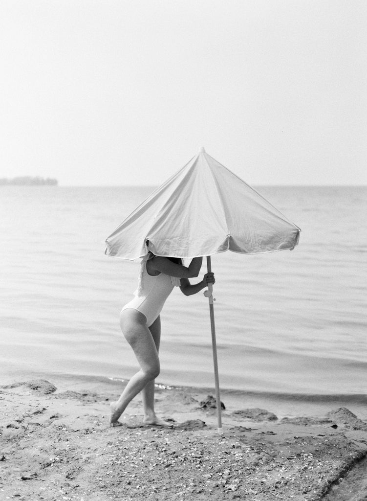 Mother Setting up Umbrella